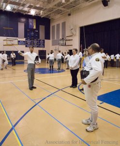 Fencers saluting the judges and directors